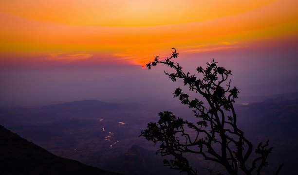 Beautiful sunset view from Lonavala hill station with orange sky and valley backdrop, Maharashtra, India.